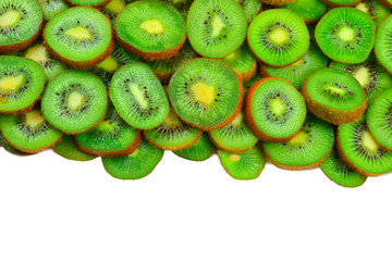 Top view of heap of sliced kiwi as textured background.