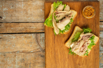 sandwich with chicken and lettuce. food background. copy space