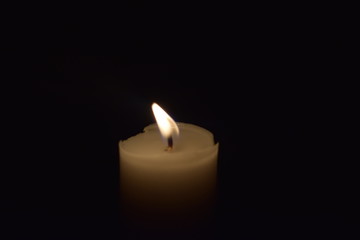 Obraz na płótnie Canvas Candle Light flame close up With black background