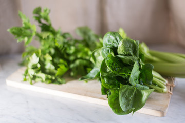 Fresh vegetables (tomato, carrots, onions, pumpkin) on a marble table, concept of healthy food.