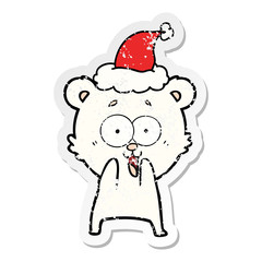 excited teddy bear distressed sticker cartoon of a wearing santa hat