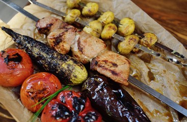 Shish kebabs from pork, tomatoes, mushrooms, zucchini. Caucasian kitchen. Men's favorite food