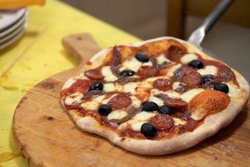 serving pizza on a cutting board