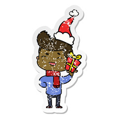 distressed sticker cartoon of a man laughing wearing santa hat