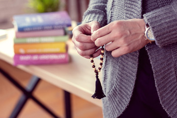 String of beads being in male hands