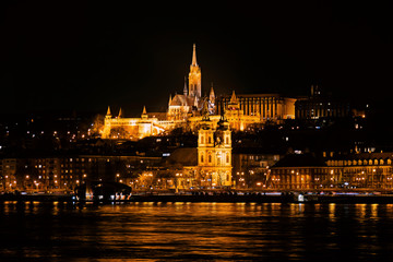 Fototapeta na wymiar The Fisherman's Bastion and the Matthias Church on the riverbank of Danube at Budapest, Hungary