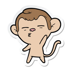 sticker of a cartoon suspicious monkey