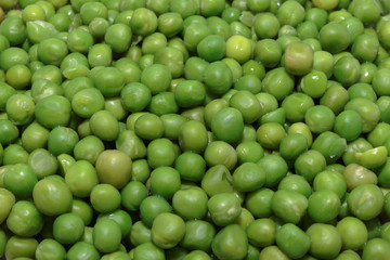 Heap of fresh green peas close-up. Concept of vegan food or natural background.