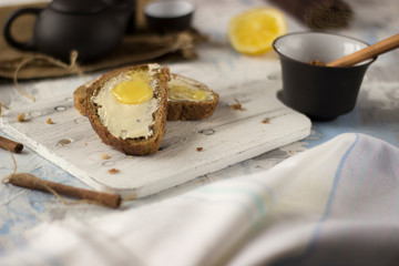 Pieces of bread with butter and honey