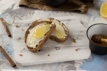 Pieces of bread with butter and honey