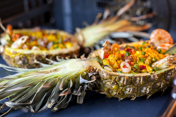 Rice in pineapple with seafood baked in the oven