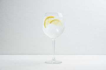 Gin based cocktail in wine glass. Selective focus. Shallow depth of field.