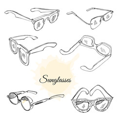 Collection of hand drawn sunglasses. Monochrome sketch objects isolated on white background.