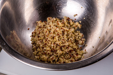 quinoa salad with tomato, cucumber and avocado jn a wh