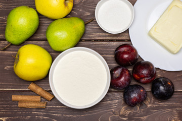 Ingredients. recipe step by step crumble with fruits flatlay on brown wood