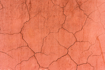 texture of an old wall painted with pink paint