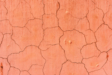 texture of an old wall painted with pink paint