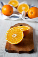 Obraz na płótnie Canvas Halved and whole oranges, low angle view. Closeup.