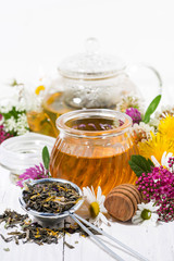 fresh flower honey, tea and ingredients, vertical