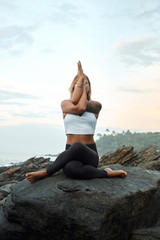 Woman Practicing Yoga in the Nature. Meditating Outdoors