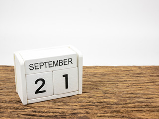 September 21 white cube wooden calendar on vintage wood and white background with autumn day, Copyspace for text, International Peace Day