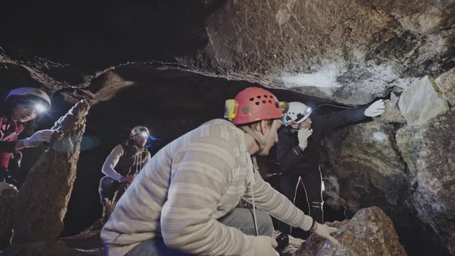 Speleologists or geologists checking a cave