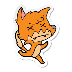 sticker of a cartoon cross eyed fox