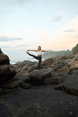 Woman Practicing Yoga in the Nature. Meditating Outdoors