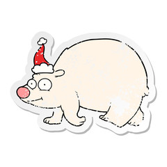 distressed sticker cartoon of a walking polar bear wearing santa hat