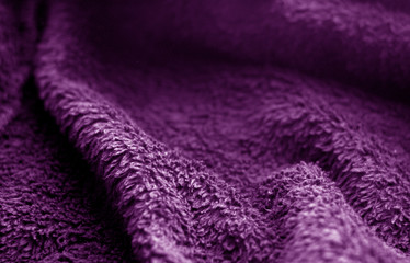 Fototapeta na wymiar Sack cloth texture with blur effect in purple color.