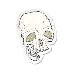 retro distressed sticker of a cartoon ancient spooky skull