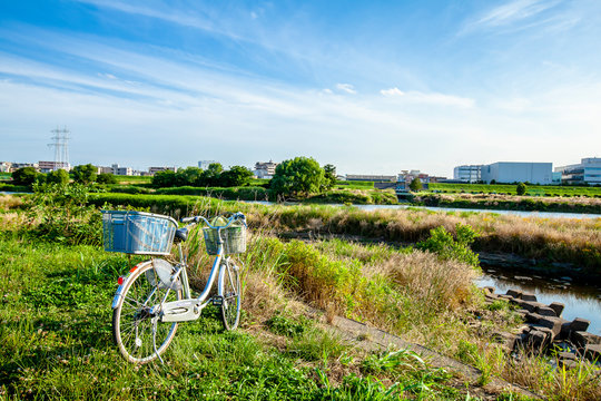 Japan Tama river bank Tokyo suburban natural landscape with bicycle 