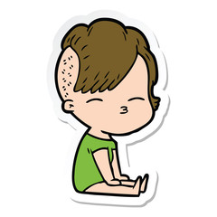 sticker of a cartoon squinting girl