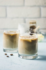 Iced bulletproof cold brew coffee. Selective focus, space for text.