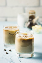 Iced bulletproof cold brew coffee. Selective focus, space for text.