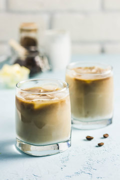 Iced bulletproof cold brew coffee. Selective focus, space for text.