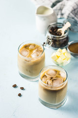 Iced bulletproof coffee. Selective focus, space for text.