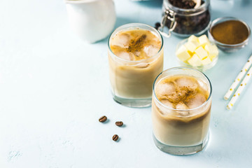 Iced bulletproof coffee. Selective focus, space for text.
