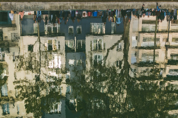 Fototapeta premium PARIS, FRANCE - 02 OCTOBER 2018: The Canal Saint Martin in the 10th arrondissement of the French capital, reflection in water