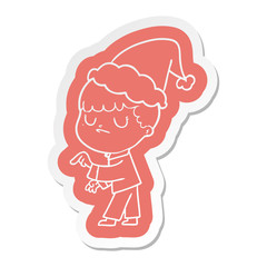 cartoon  sticker of a grumpy boy wearing santa hat