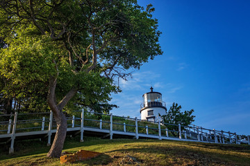 Lighthouse with trees and walkway