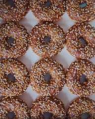 Chocolate donut with nuts. Chocolate donut with chopped almonds. Donut on white background