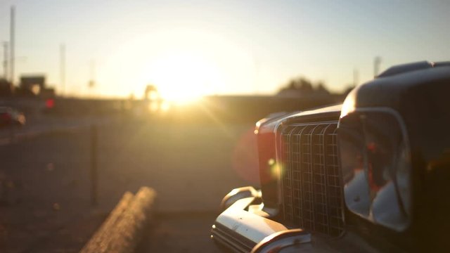 Vintage car grill with sunrise