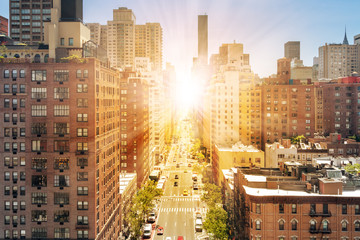 New York City overhead street view with sunlight shining on the streets and sidewalks of Midtown...