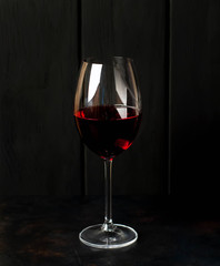 glass of wine on a dark background