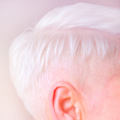 Color scheme. Women's short haircut. Fashionable stylish profile with white short hair. Cute neat girl with a haircut on the back of his head. Hairstyles for women.