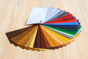 Lamination samples. On a wooden background for lamination of any wooden and plastic products used...