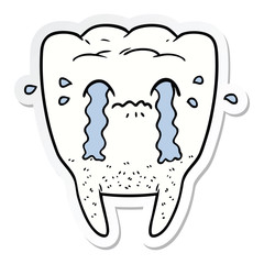 sticker of a cartoon tooth crying