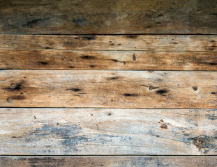 The texture of the old log on the house. Close-up. Wooden background.