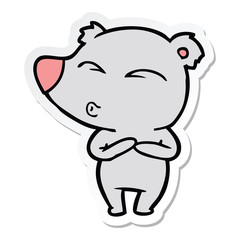 sticker of a cartoon whistling bear
